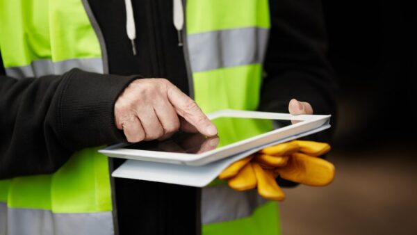 Worker using tablet on site
