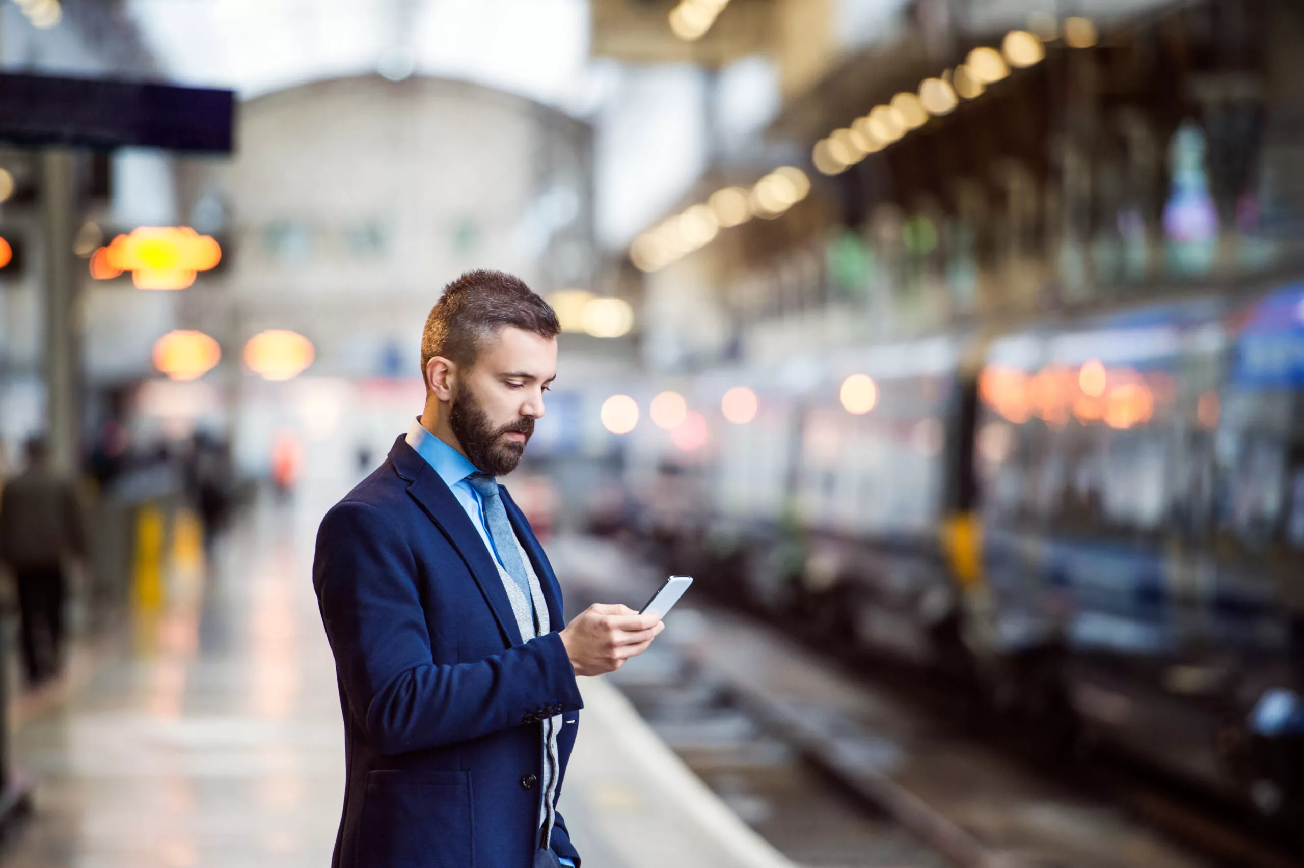 Commuter checking train timetable on phone